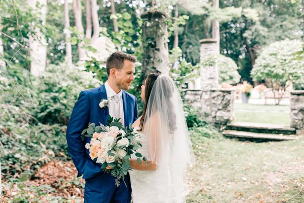 Bride and groom outside in the garden